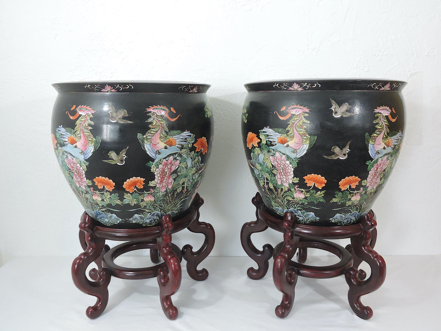 Early 20th Century Family Noire Black Chinese Porcelain Planters With Goldfish & Phoenix Birds - a Pair, on Rosewood Stands