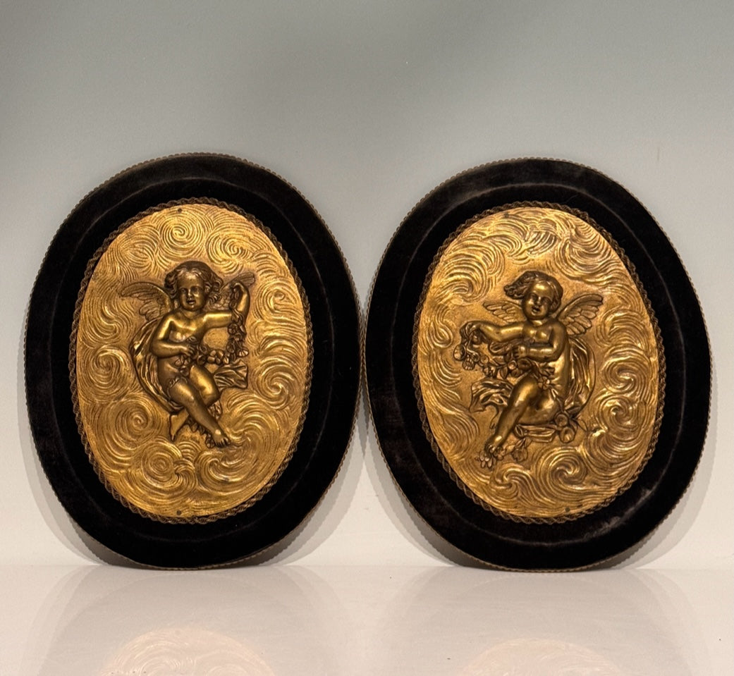 Antique French Gilt Bronze Oval Plaques of Winged Cherubs or Putti in High Relief, an Opposing Pair