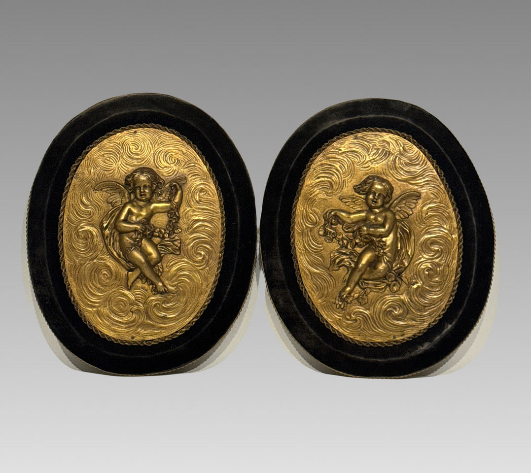 Antique French Gilt Bronze Oval Plaques of Winged Cherubs or Putti in High Relief, an Opposing Pair