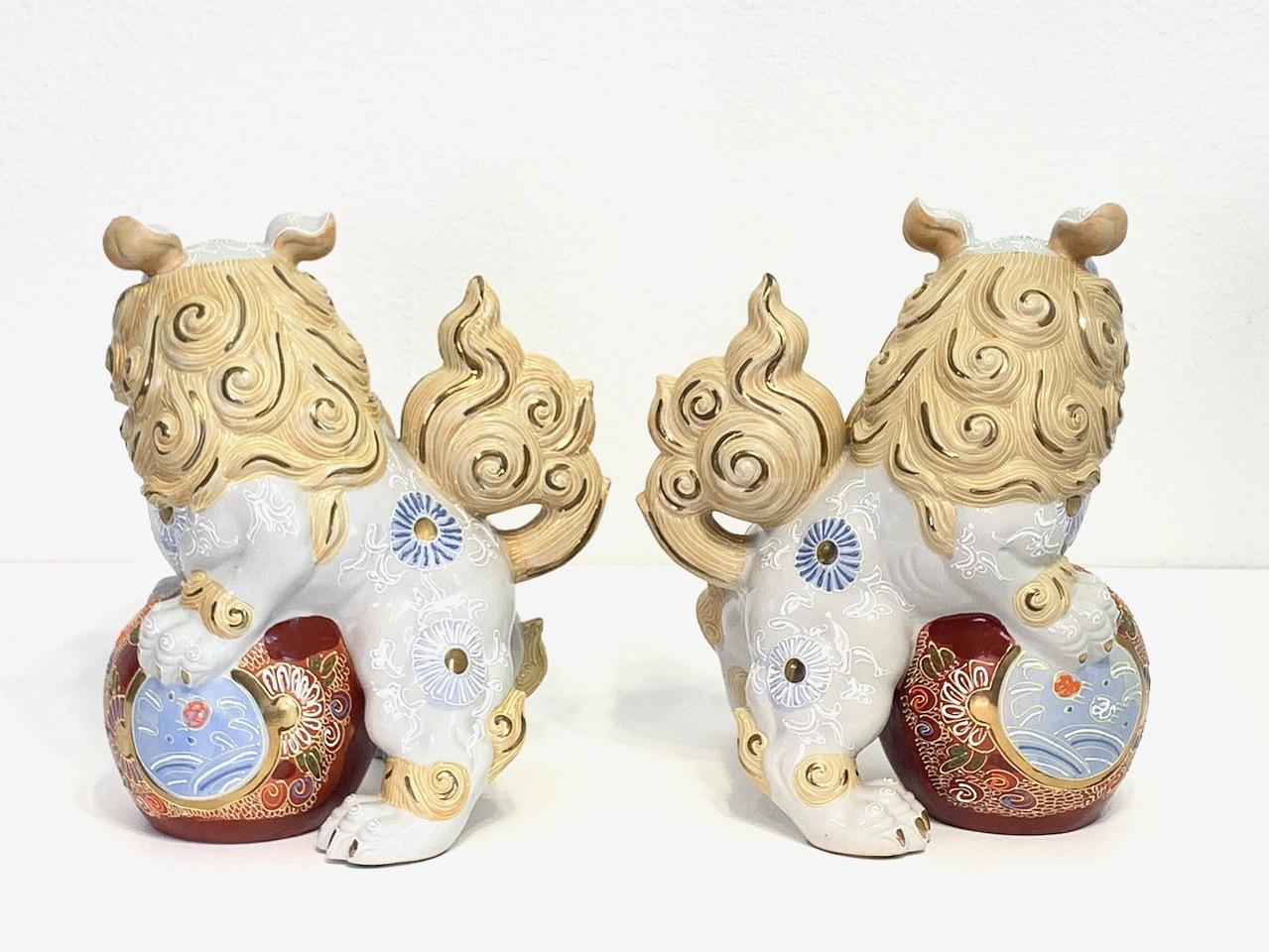 Japanese White & Gilt Porcelain Satsuma Male Foo Lions (Shishi Fu Dogs) - a Pair