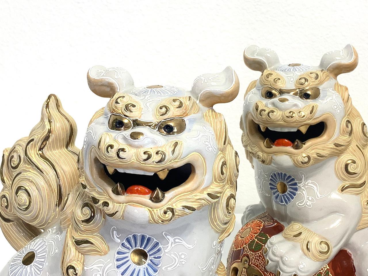 Japanese White & Gilt Porcelain Satsuma Male Foo Lions (Shishi Fu Dogs) - a Pair