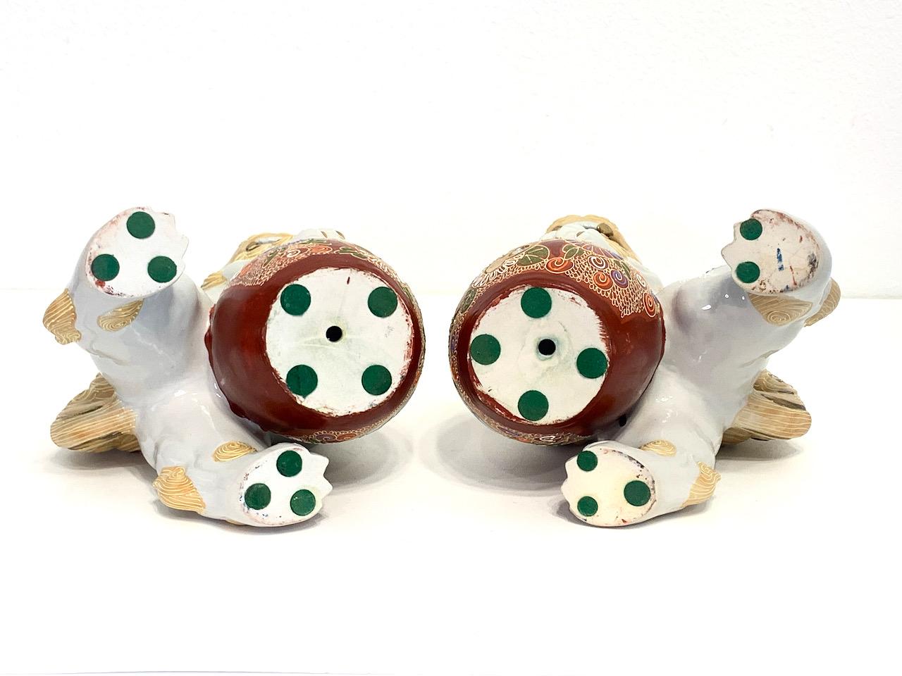 Japanese White & Gilt Porcelain Satsuma Male Foo Lions (Shishi Fu Dogs) - a Pair